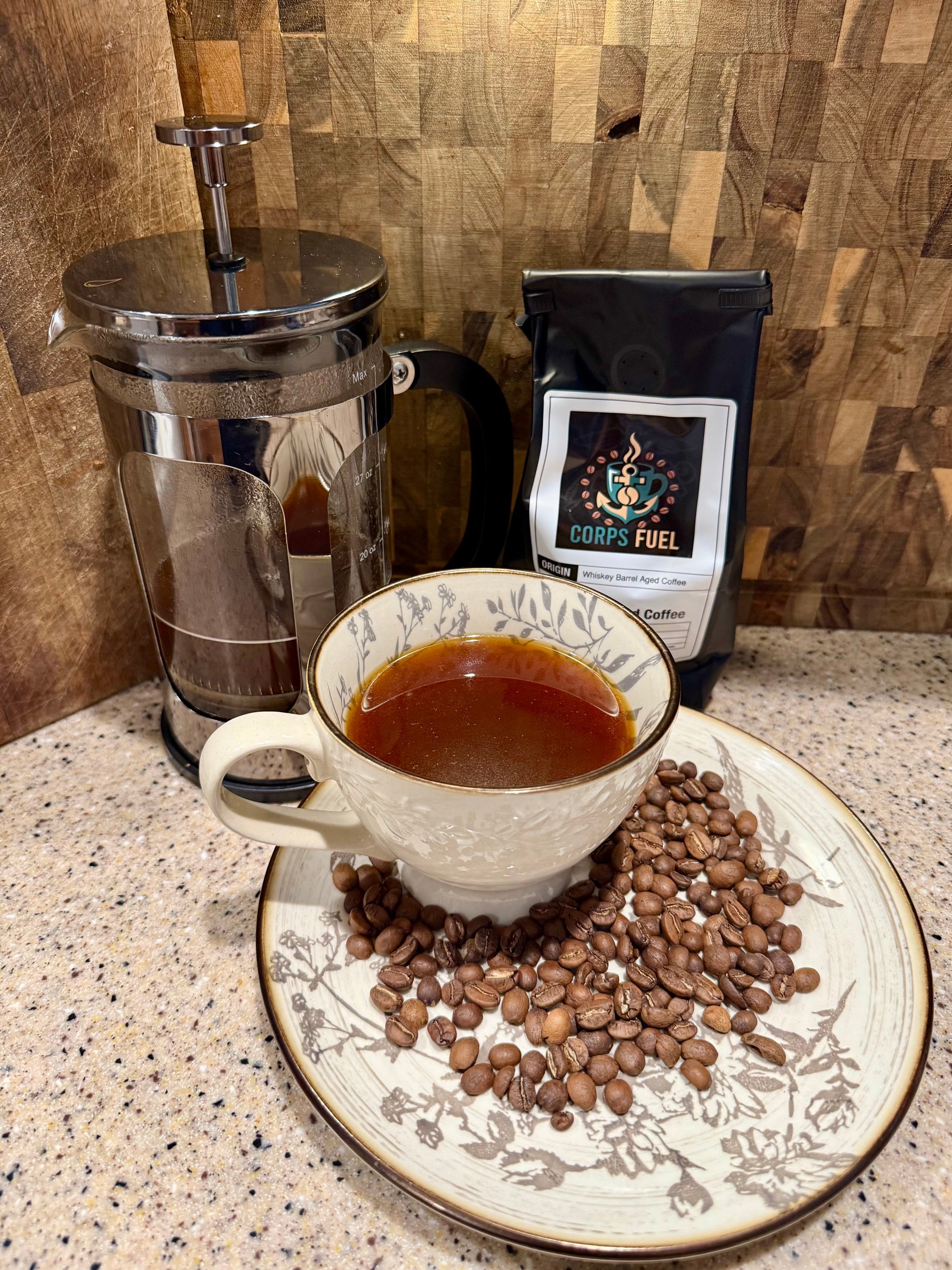 Whiskey Barrel Aged Coffee black, French press, and coffee beans
